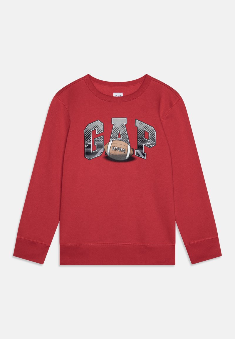 Red sweatshirt with long sleeves and a crew neck, featuring "GAP" in gray block letters and a football graphic centered below.