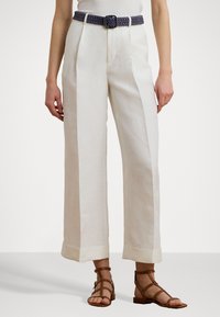 Linen wide-leg trousers in pale cream with double pleats and contrasting blue woven belt. Features turn-up cuffs and a relaxed fit.