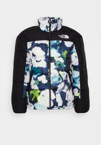 Chaqueta acolchada con un estampado floral en azul, blanco y verde, con una sección superior negra y un alto cuello. Cierre con cremallera.