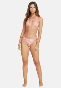 Pink floral bikini featuring a triangular top and tie-side bottoms, made from stretchy material with a smooth texture.