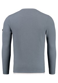 Graues langärmliges Shirt mit einer strukturierten, gerippten Optik. Eigenschaften: runder Ausschnitt und ein mehrlagiger weißer Saum am unteren Ende.