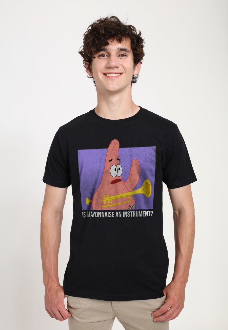 Black cotton t-shirt featuring a cartoon character holding a yellow trumpet with a purple background and the text “IS MAYONNAISE AN INSTRUMENT?”