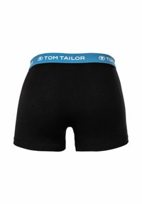 Boxer in cotone nero con elastico azzurro chiaro, decorato con il nome del marchio "TOM TAILOR" stampato in bianco. Design semplice.