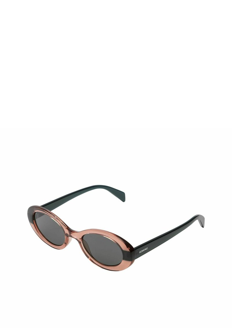 Lunettes de soleil en forme d'œil de chat avec une monture transparente rose, des verres foncés et des branches noires. Texture lisse et forme ovale.