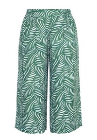 Vihreät leveälahkeiset housut, joissa on valkoinen trooppisten lehtien kuvio ja joustava vyötärönauha.