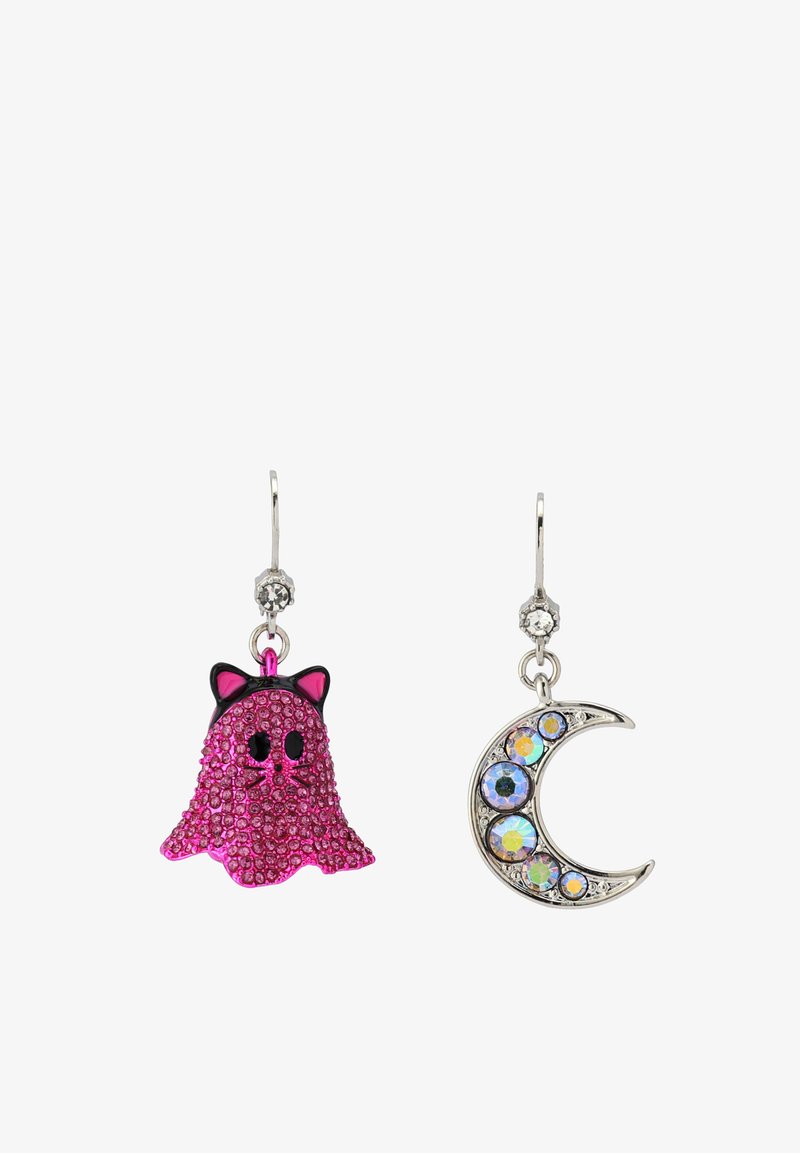 Pink glitter ghost earring with black accents on the left; silver crescent moon earring with iridescent stones on the right.