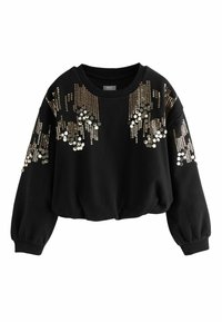 Svart kortärmad sweatshirt med detaljer av guld- och silverpaljetter i ett draperat mönster över framsidan och ärmarna. Mjuk, texturerad tyg.