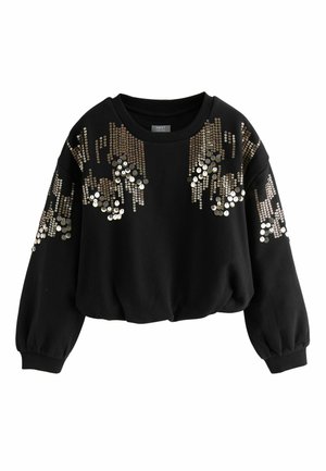 Sweatshirt noir court avec des détails en sequins dorés et argentés dans un motif drapé sur le devant et les manches. Tissu doux et texturé.