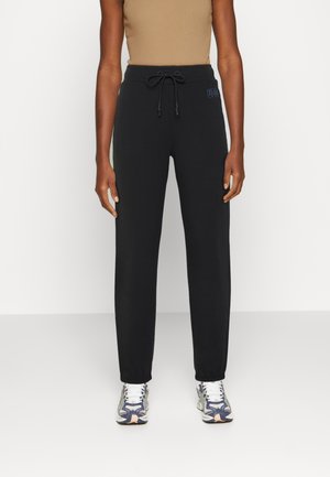 DANIELLA - Tracksuit bottoms - black