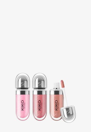 Drie tubes KIKO Milano glinsterende lipgloss in roze tinten; één open met applicator die perzikroze gloss toont.
