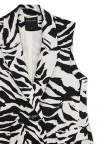 Ärmelloser Blazer mit schwarz-weißem, abstraktem Zebra-Muster, Reverskragen, zwei schwarzen Knöpfen und vorderen Klappentaschen, Größe S, Etikett sichtbar.