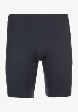 Shorts de sport noirs à coupe ajustée, dotés d'une taille haute, de poches latérales et d'une texture lisse. Agrémentés de détails réfléchissants.
