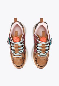 Pair of multicolored suede sneakers with animal print, pastel blue laces, orange circular logo, and thick white soles, shown from top view.