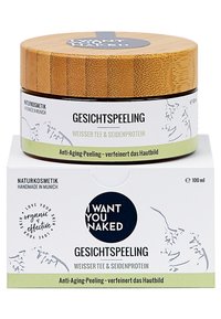 Bambulock utan ansiktsskrubb burk med vit och grön etikett. Texten inkluderar "JAG VILL HA DIG NAKEN" och ingredienserna "Vitt Te & Silkestprotein." 100 ml.