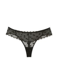 Black mesh thong with polka dot pattern, scalloped edges, and a classic cut. Features a sheer texture and contrasting solid waistband.