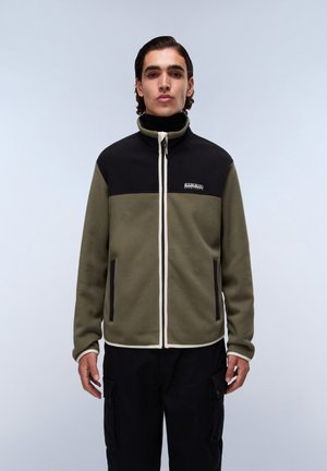 Fleece jacket with a black upper section and olive green lower section, featuring a high collar, white zipper, and two side pockets.