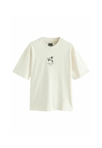 Camiseta de algodón color crema con mangas cortas, escote redondo y estampado floral en negro en el centro. Corte casual.