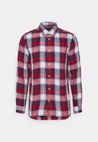 Rood, wit en marineblauw geruite overhemd met lange mouwen, een puntige kraag en een gebogen zoom. Gemaakt van lichtgewicht stof.