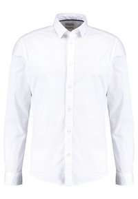 Biała, długa koszula z długim rękawem, wykonana z gładkiej bawełny. Posiada klasyczny kołnierzyk, przednie guziki oraz zaokrąglony dół z mankietami zapinanymi na jeden guzik.