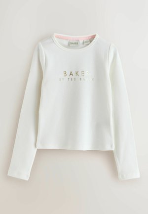 Bílý dlouhý rukáv top v ribovaném textilu se zlatým potiskem "BAKER by TED BAKER" uprostřed na hrudi. Kulatý výstřih, zkrácený střih.