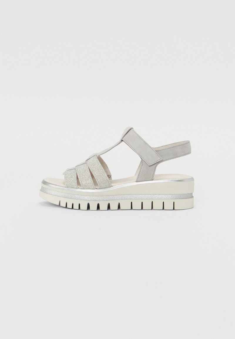 Silver and grey sandals with a textured upper, featuring cross straps, adjustable ankle strap, and a chunky white platform sole.