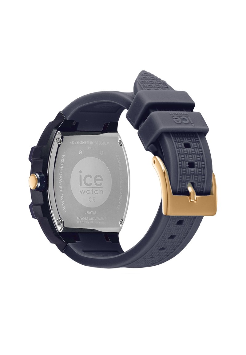 Montre en silicone noir avec un bracelet texturé, boucle en or, fond en acier inoxydable et cadran rond. Conçue en Belgique, résistance à l'eau jusqu'à 5 ATM.