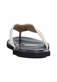 Infradito da uomo con suola in gomma nera, cinturini intrecciati beige e design piatto. La forma è minimalista, adatta per un look casual.