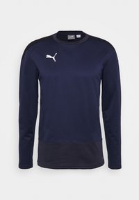 Maglia sportiva a maniche lunghe Puma blu navy con accenti neri sulle spalle e sul fondo, con logo Puma bianco sul petto.