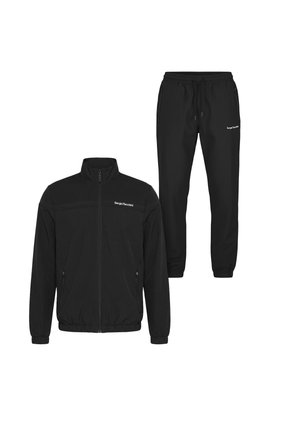 Survêtement noir deux pièces avec veste zippée et pantalon jogger taille élastique, les deux avec petits logos blancs "Sergio Tacchini".