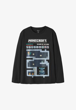 Czarna koszulka z długim rękawem z motywem gry Minecraft pokazującym postać, układ jaskini, serca, narzędzia i frazę "Beware of the Dark."