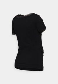 Black t-shirt with short sleeves, featuring a lace trim around the neck and sleeves. The fabric appears smooth with a fitted shape.