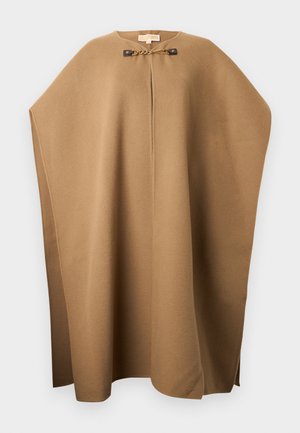 Poncho en laine marron avec un col rond, des fentes sur les côtés et un fermoir en chaîne décoratif à l'avant. Texture douce et design simple.