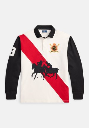Long-sleeve polo shirt in white with black sleeves, red diagonal stripe, embroidered horse polo scene, and logo. Cotton fabric. Number 3 detail.