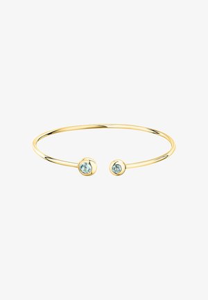 Bracciale rigido in oro con un design sottile e liscio, caratterizzato da due gemme rotonde di un blu chiaro su ciascun capo, incastonate in accenti circolari lucidi.