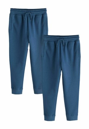 Zwei Paar blaue Jogginghosen mit elastischen Bund, Kordelzug, Seitentaschen und Bündchen an den Knöcheln auf weißem Hintergrund.
