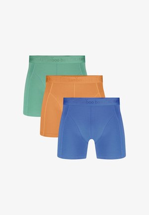 Trois boxers pour hommes en bleu, orange et vert, disposés en chevauchement avec des ceintures élastiques de marque.