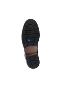 Semelle de chaussure en caoutchouc noir avec un motif de treads texturé, présentant une forme incurvée et un intérieur brun clair. Étiquette bleue présente près du talon.
