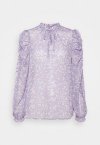 Blouse lavande avec des taches abstraites blanches, manches longues bouffantes, poignets et encolure à volants, et un petit nœud papillon au cou.