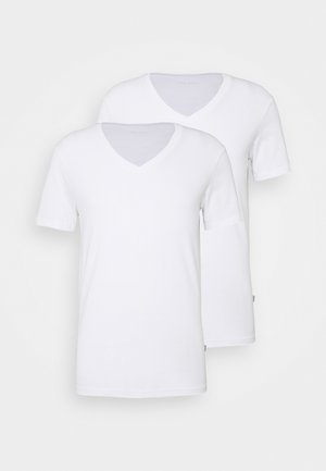 Two white v-neck t-shirts made of soft cotton. One has short sleeves, the other is long-sleeved, both featuring a seamless design.