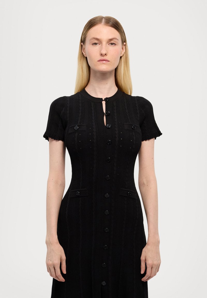 black sandro dress Sabah Fancy Knit Maxi The brands design aesthetic is inspired by evelynes childhood in morocco and classic parisian chic style Constance Short Knit Dress Black