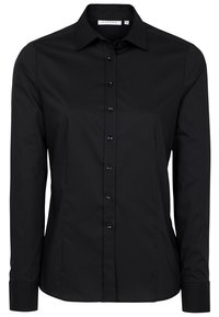 Chemise habillée noire à manches longues, cintrée, avec fermeture boutonnée et col pointu.