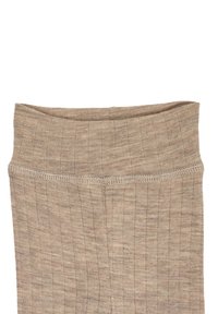 Beżowe prążkowane legginsy z wysokim stanem. Miękka faktura, elastyczna talia i subtelne detale przeszycia wzdłuż górnej krawędzi.