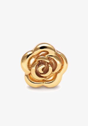 Épingle en forme de rose métallique dorée avec un design détaillé des pétales, surface lisse et réfléchissante, photographiée sur un fond blanc.