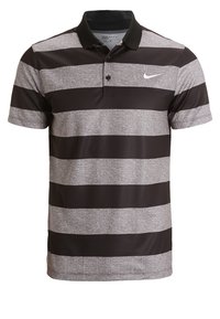 Polo rayé noir et gris avec un col, des boutons et un petit logo Nike sur la poitrine. Confectionné en matière lisse et respirante.