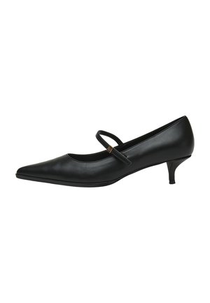 Chaussure Mary Jane en cuir noir à bout pointu, petit talon kitten et une bride unique sur le dessus, fermée par une petite boucle dorée.