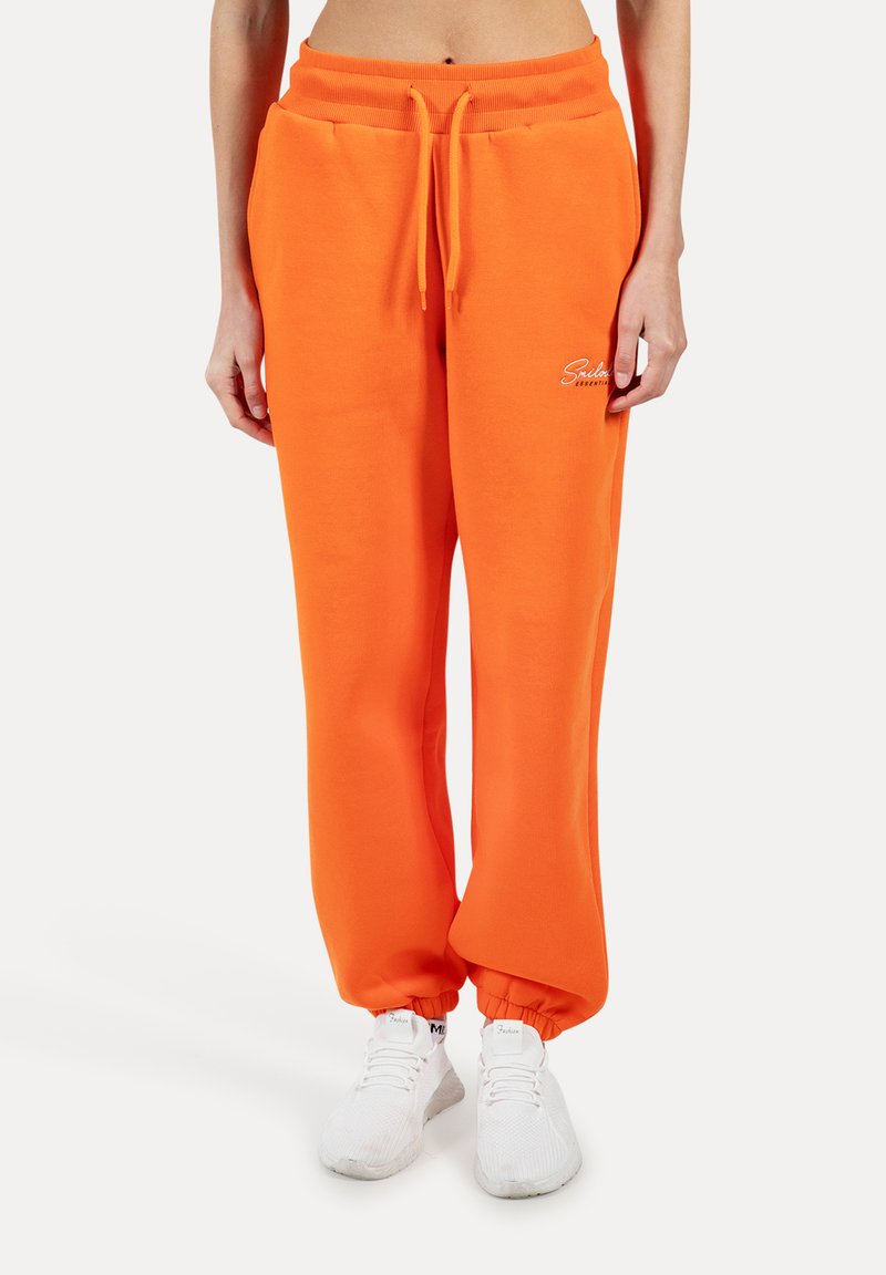 Orange Sweatpants mit elastischem Bund und Bündchen, mit einem weißen Logo-Akzent. Hergestellt aus weichem, dickem Stoff für optimalen Komfort.
