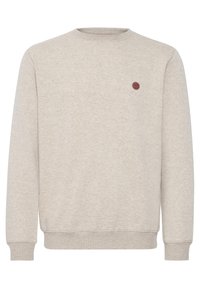Sweatshirt i lys beige, lavet af blød bomuldsblanding. Rund hals, ribbede manchetter og kant, prydet med et lille rundt logo på brystet.