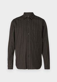 Long-sleeve shirt in dark green plaid pattern, button-down front, single chest pocket, made of textured fabric with subtle stripes.
