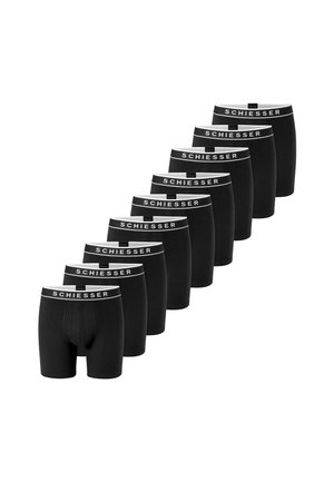 Ni par sorte boxer briefs med hvide linninger mærket "Schiesser" arrangeret i en diagonal linje på hvid baggrund.