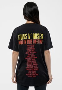 Paradiso Clothing GUNS N' ROSES NOT IN THIS LIFETIME PISTOLS & ROSES - Print T-shirt - black